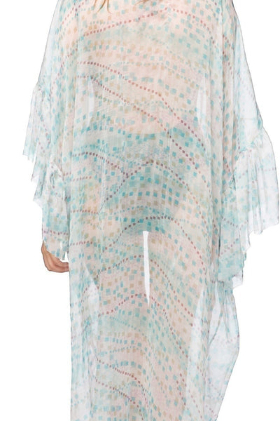 Subtle Luxury silk kimono coverup featuring a geo squared print and flowing bell sleeves worn over a black bodysuit. 2