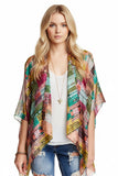 Subtle Luxury silky crop kimono coverup featuring a vibrant multi-colored geometric print on a lightweight fabric.