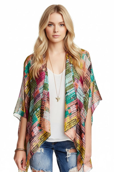 Subtle Luxury silky crop kimono coverup featuring a vibrant multi-colored geometric print on a lightweight fabric.