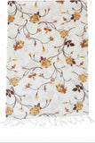 Subtle Luxury wool scarf featuring a white background with a romantic orange and brown floral rose print and fringe