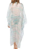 Subtle Luxury silk kimono coverup featuring a geo squared print and flowing bell sleeves worn over a black bodysuit. 2