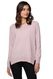 Woman wearing a light pink cashmere sweater women's crewneck cashmere sweater