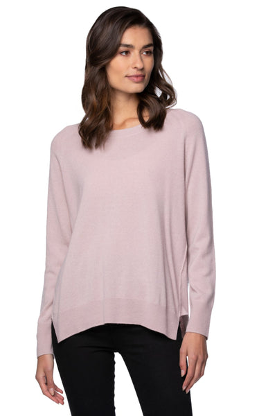 Woman wearing a light pink cashmere sweater women's crewneck cashmere sweater