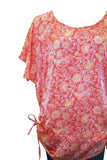 Subtle Luxury printed silk tunic dress in coral with floral pattern, crew neck, short sleeves, and side drawstrings.