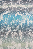 Subtle Luxury maxi dress fabric featuring a blue and white Dragon Wings abstract print on sheer polyester material