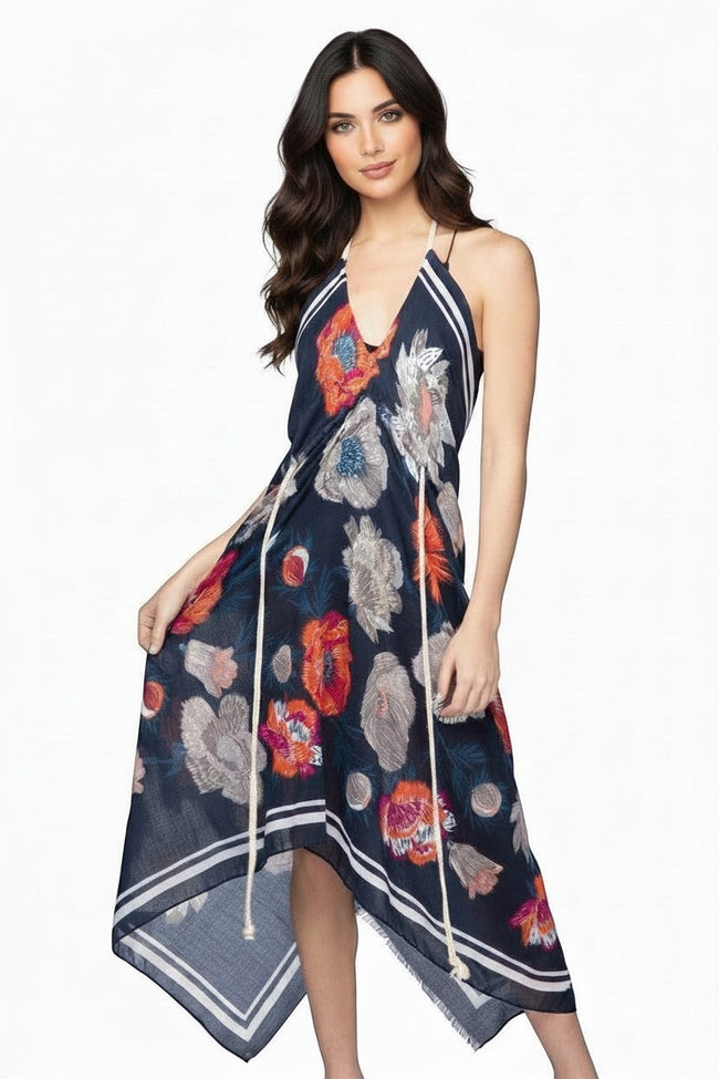 Subtle Luxury navy floral halter neck dress with rope straps and handkerchief hem on a model